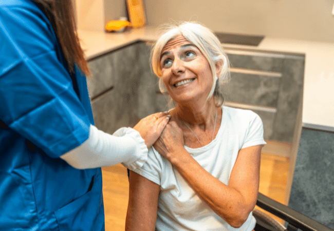 Assisted living resident receiving personal care assistance in Rockford, IL facility